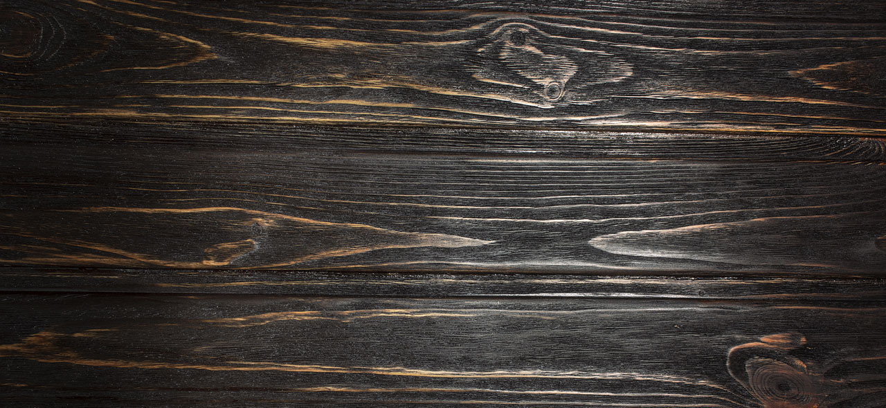 Ebony hardwood flooring texture closeup. 