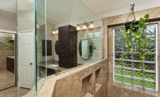 Bathroom wall with glass block tiles and mirror