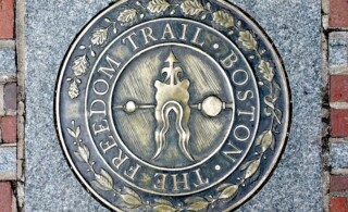 Sidewalk emblem of The Freedom Trail in Boston