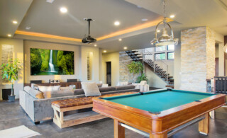 A newly remodeled basement with a pool table