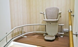 Stair lift on staircase for elderly people.