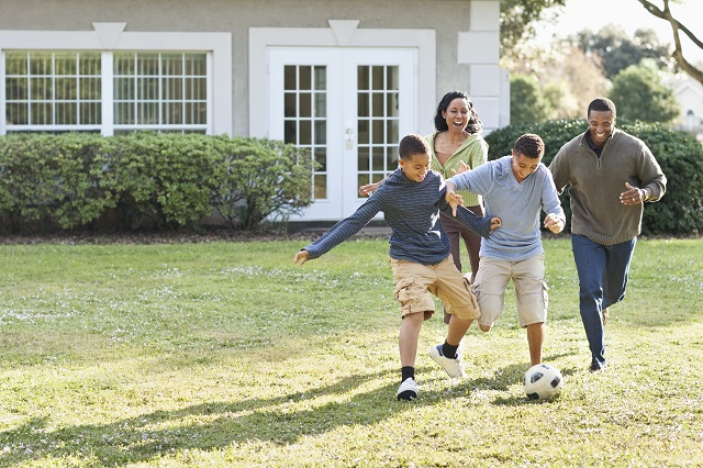 family playing soccer