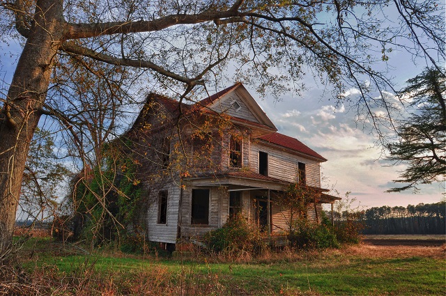 Haunted-looking Farmhouse at Sunset