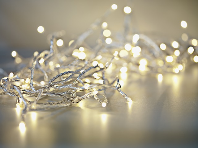 String of delicate lit fairy lights on a table