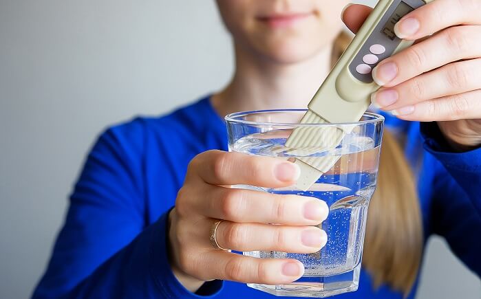 lab tech tests drinking water quality