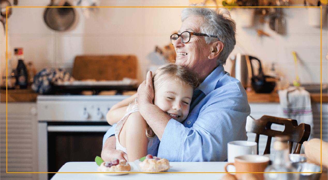 Woman hugging child at kitchen table