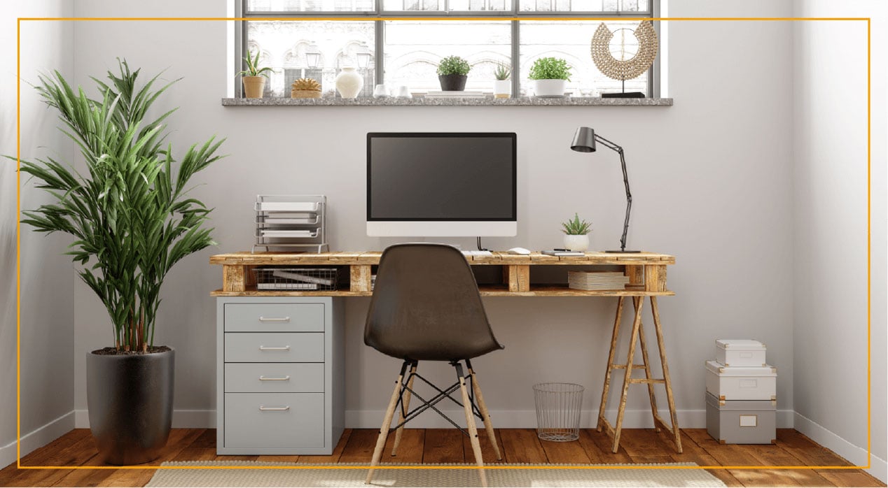 Office desk with computer and brown chair