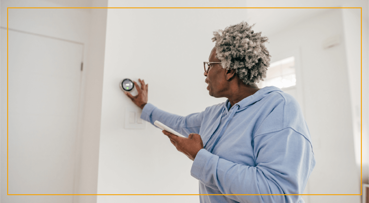 Woman changing indoor temperature