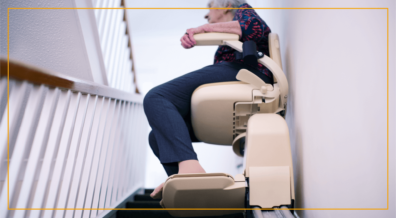 Woman sitting in a stairlift