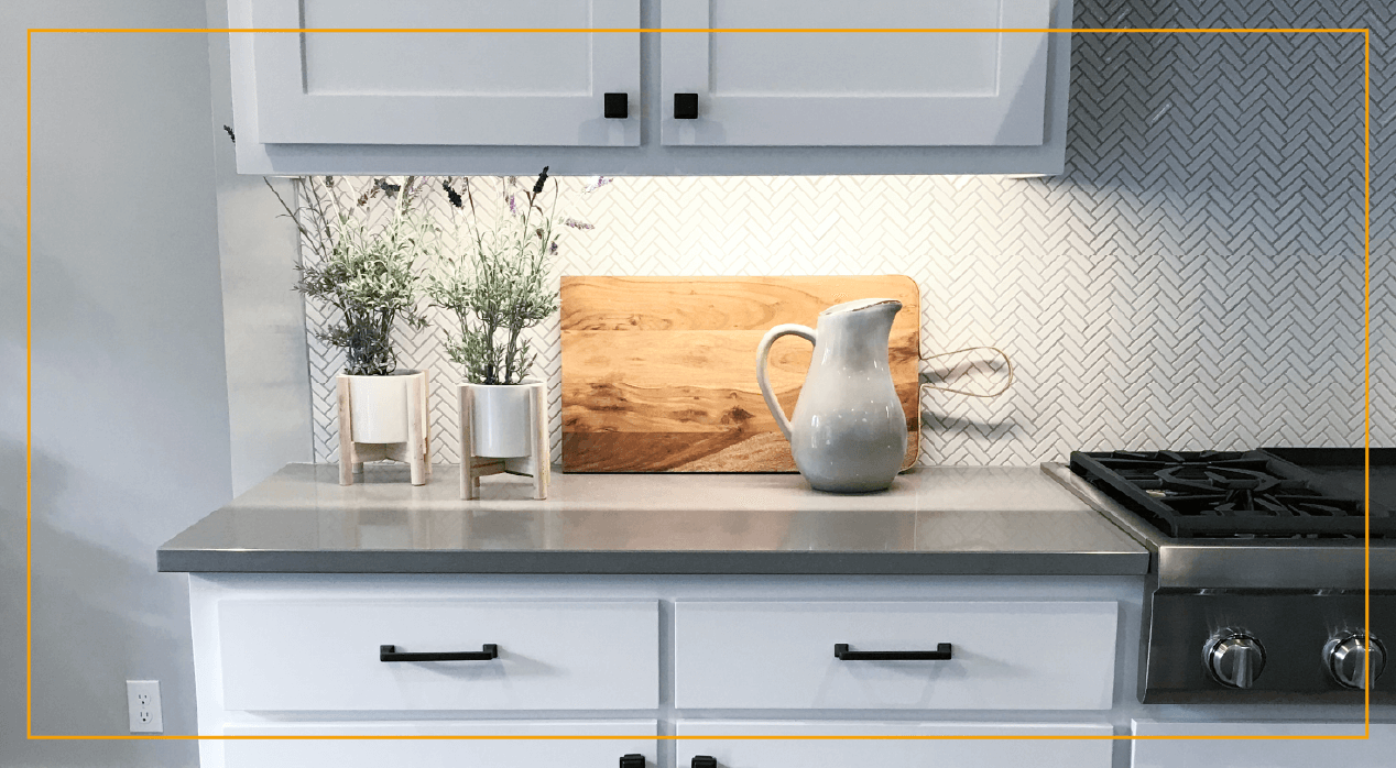 Kitchen cabinets with flowers and cutting board 
