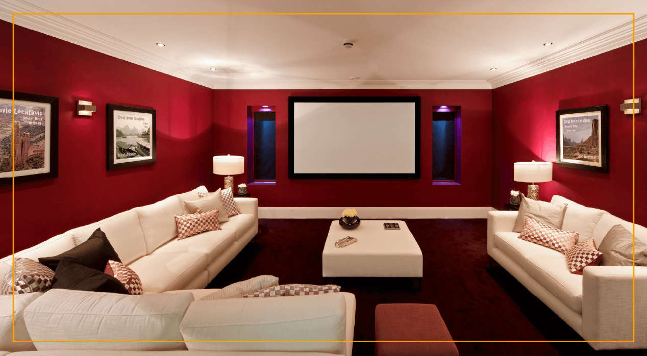 basement home movie theater with red walls