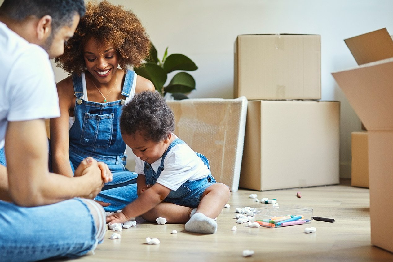 Parents watch daughter play in new house