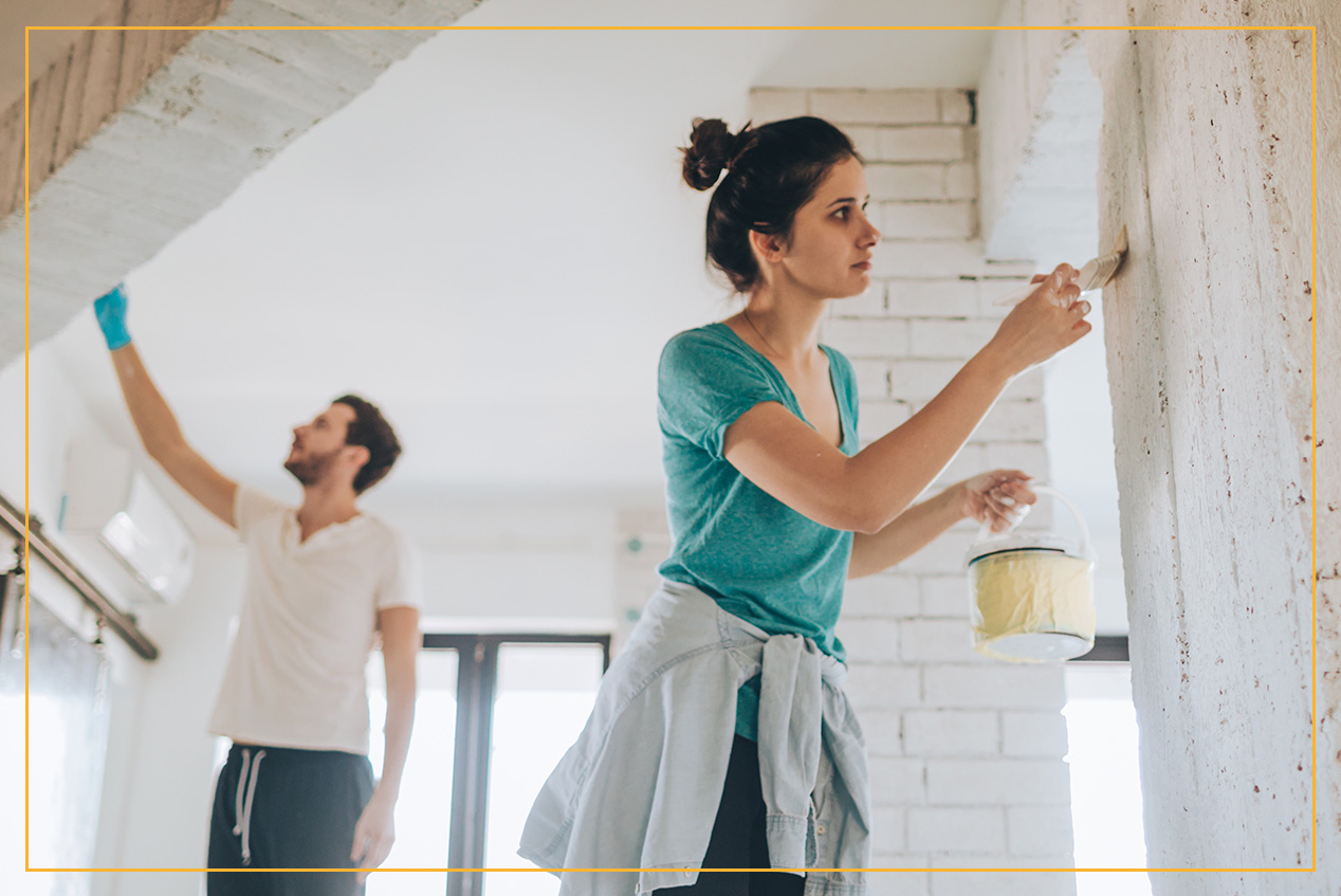 couple painting walls 