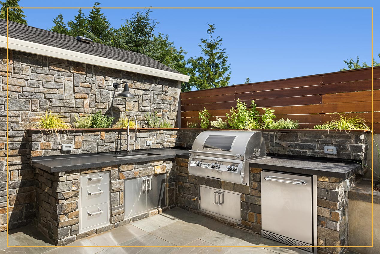 stone veneer outdoor patio grilling area