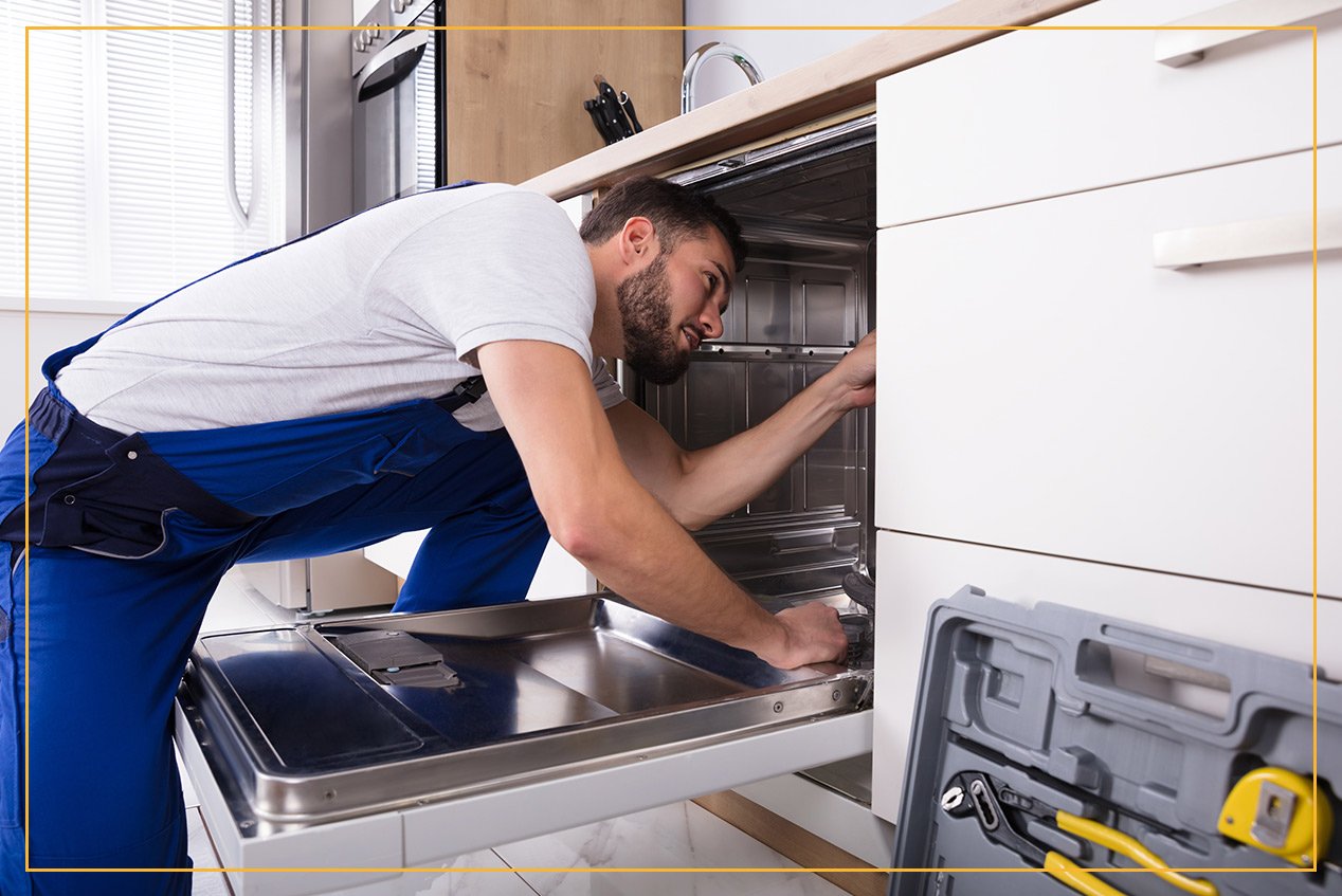 worker installing appliance 