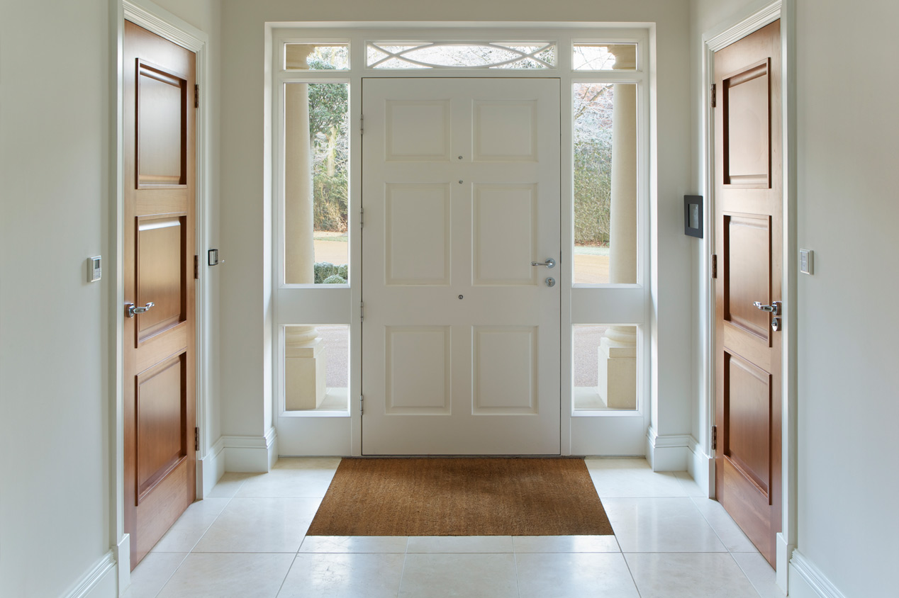 A front door entrance with tile flooring