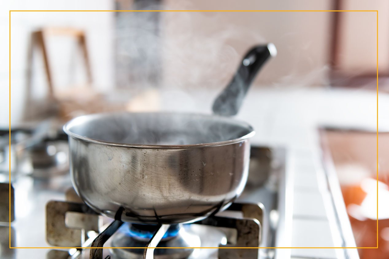 steaming pot saucepan on stove