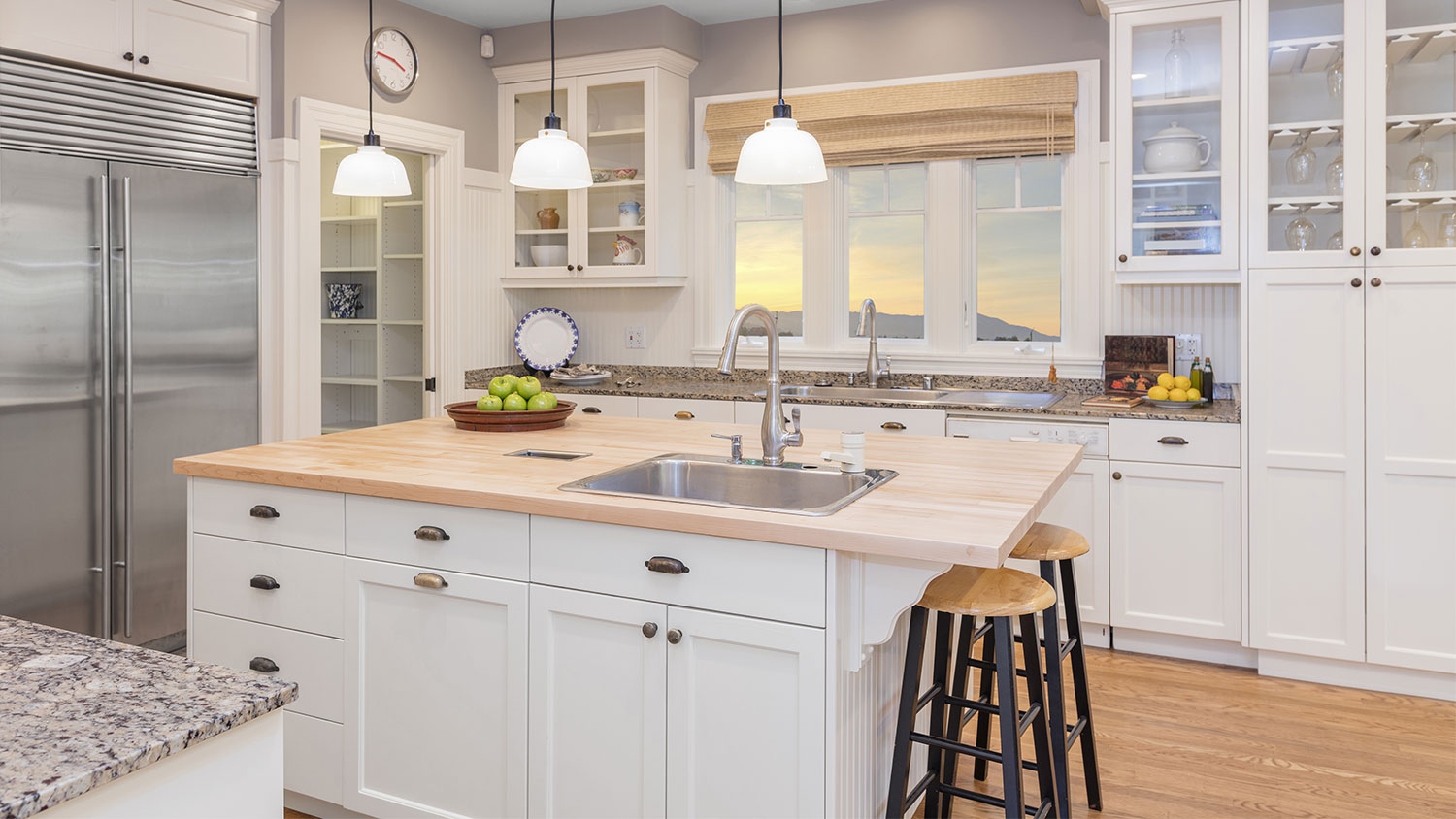 Luxury kitchen interior with island and stools