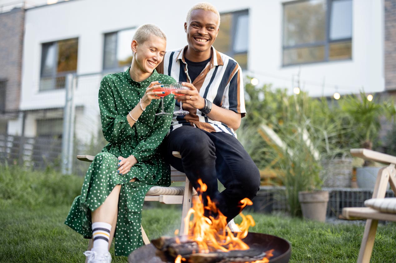 Couple drinking cocktails during home party in their garden