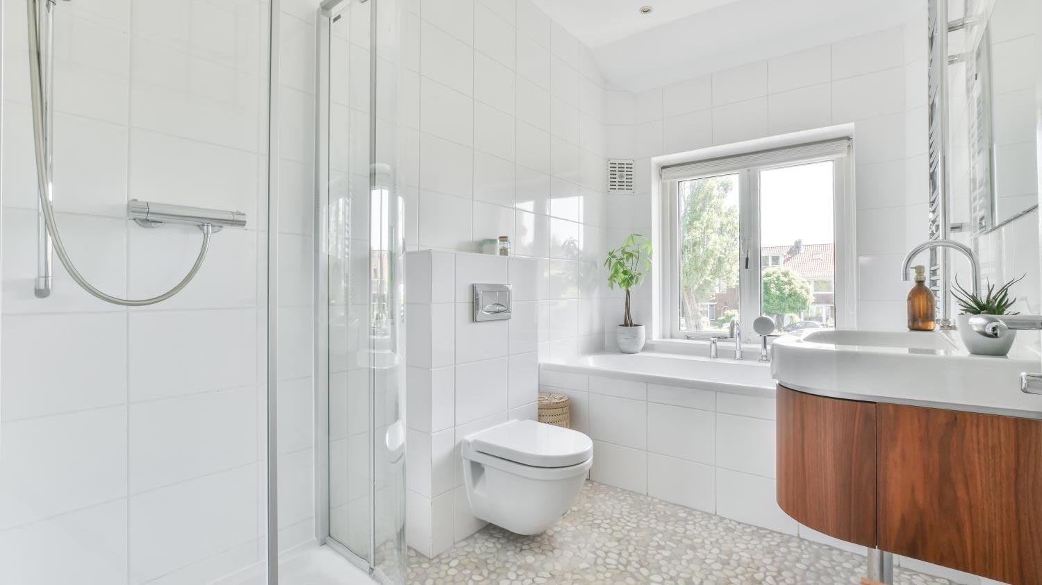 White bathroom with tile floor 